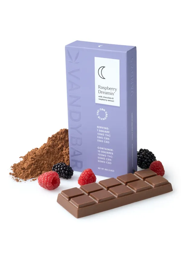 Raspberry Dreamin' VandyBar box in lavender with a milk chocolate bar, raspberries, blackberries and cocoa powder. The box lists 10mg THC, 5mg CBN and 5mg CBD per square.